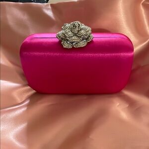 Elegant Pink Clutch with Floral Accent